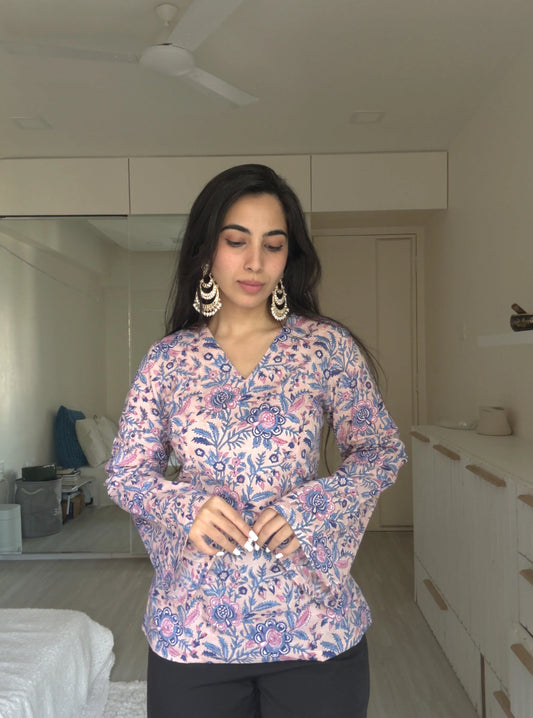 “Woman wearing pastel floral bell sleeves kurti – Aditi front view”