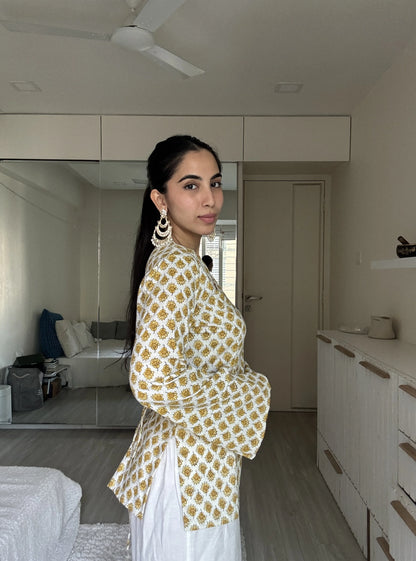 “Woman wearing off‑white yellow printed bell sleeves kurti – Gunjan front view”