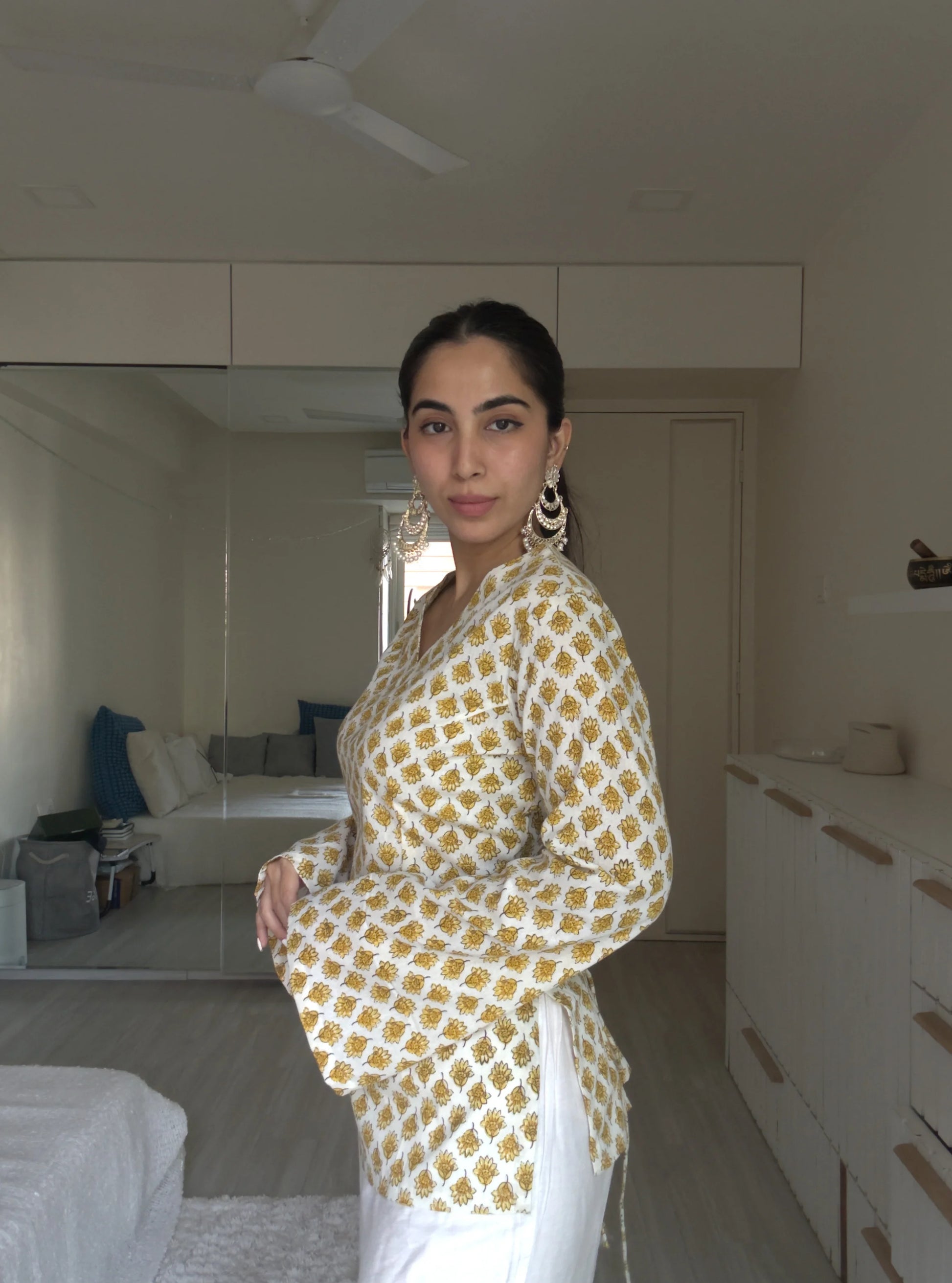 “Flared bell sleeves detail on Gunjan off‑white yellow printed kurti”