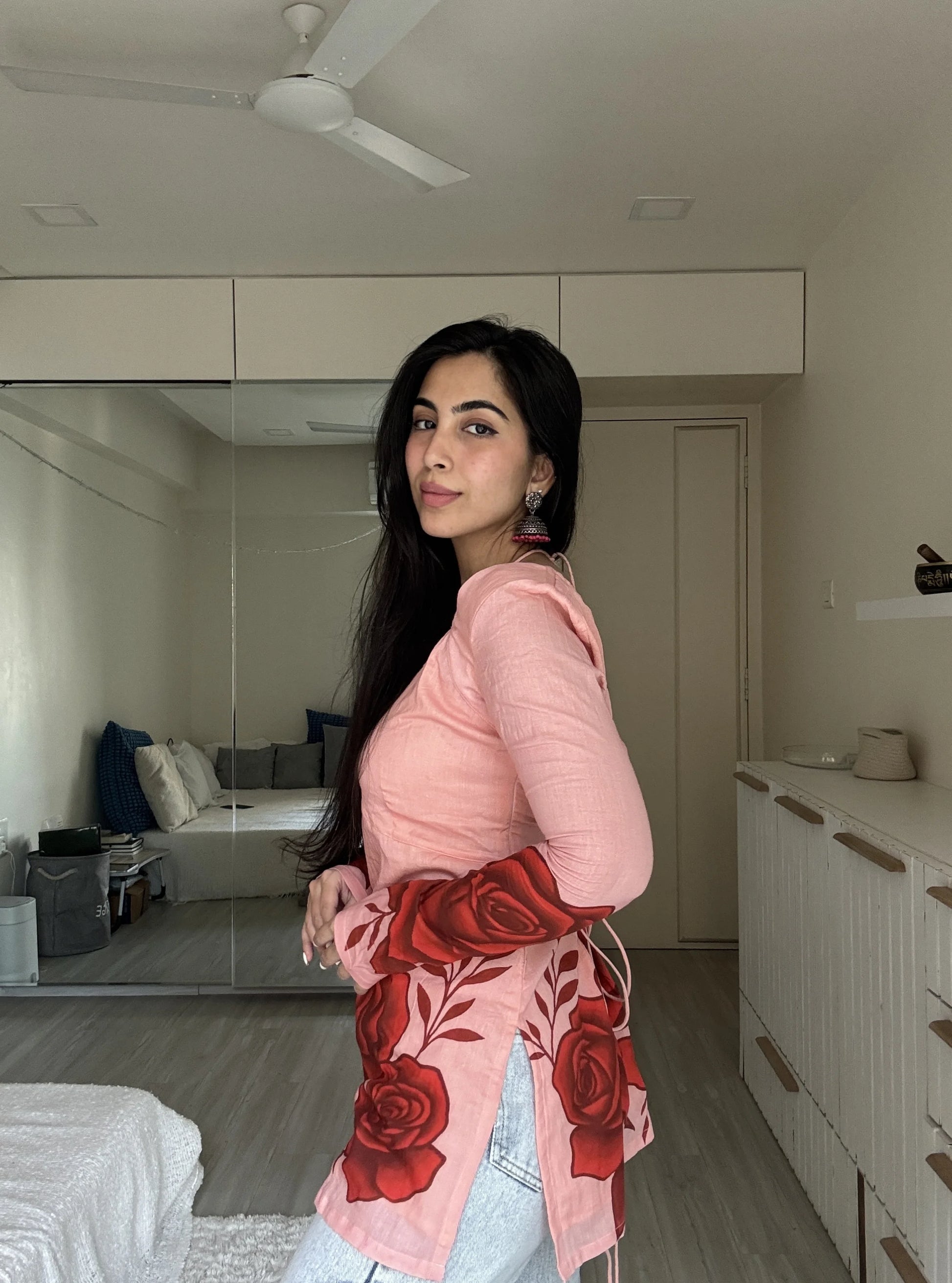 “Red rose motif along hemline of Heer blush pink long sleeved kurti”