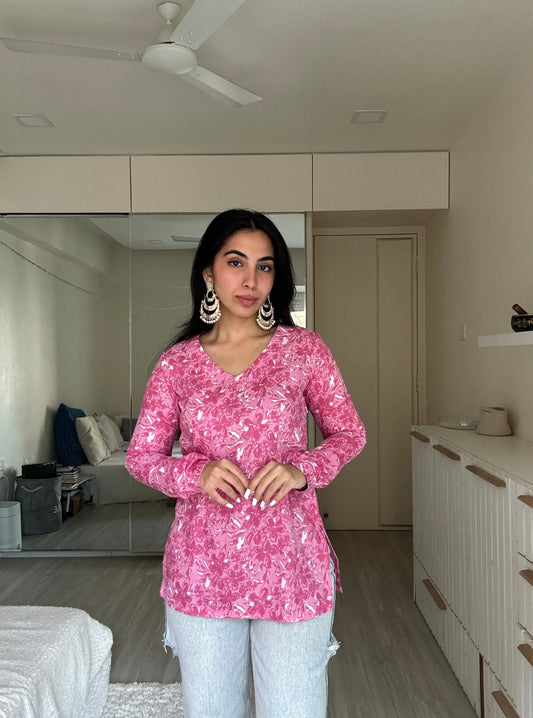 “Woman wearing bright pink floral long sleeved kurti – Kiara front view”