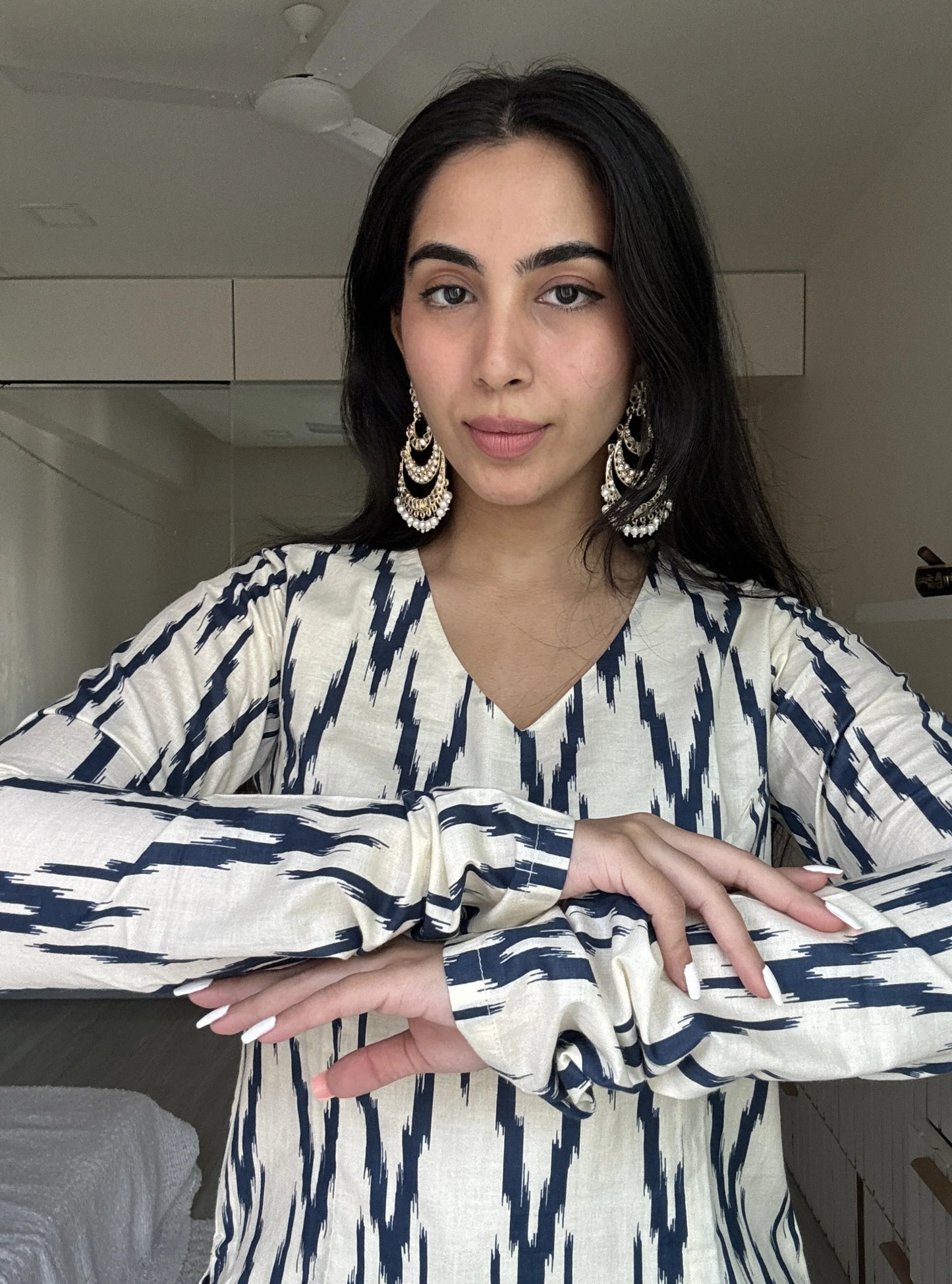 “Close‑up of navy ikat pattern and V‑neckline on Naina sleeved kurti”