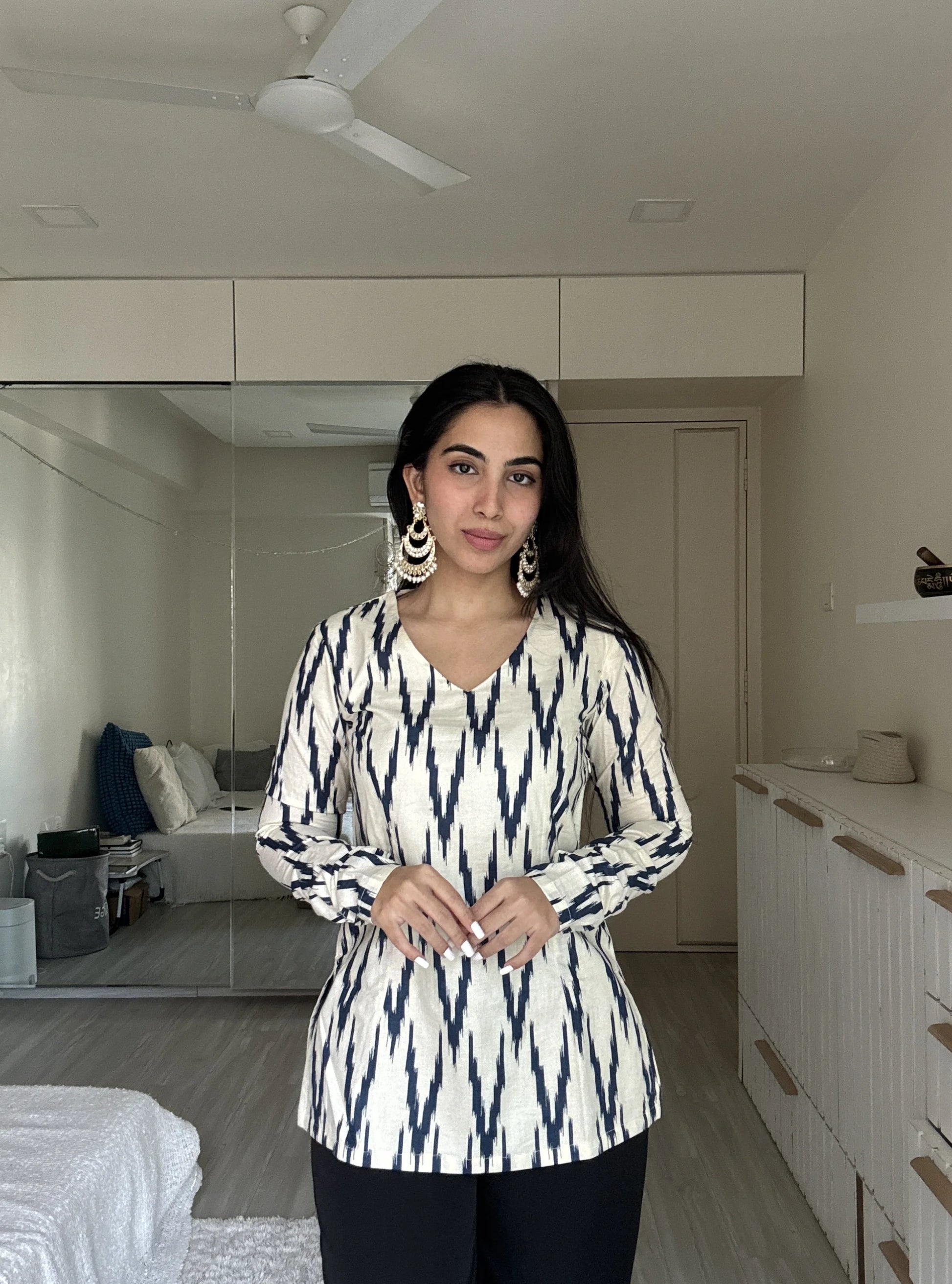 “Sleeve detail of Naina off‑white navy ikat long sleeved kurti”