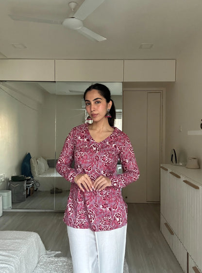 “Woman wearing pink floral long sleeved kurti – Tanisha front view”