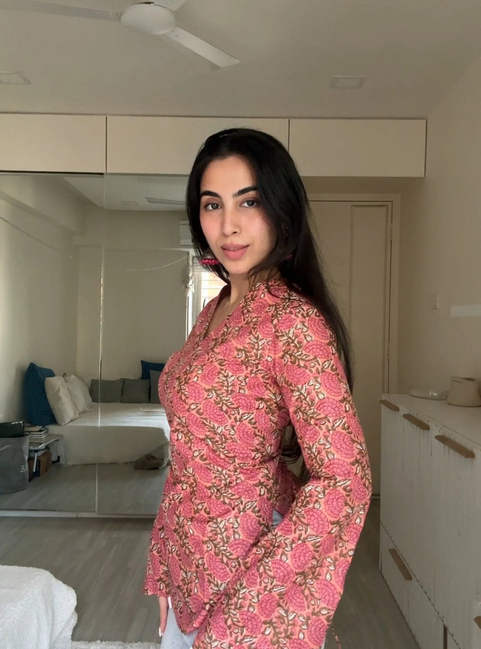 “Close‑up of floral print and V‑neckline on Urvi pink kurti”