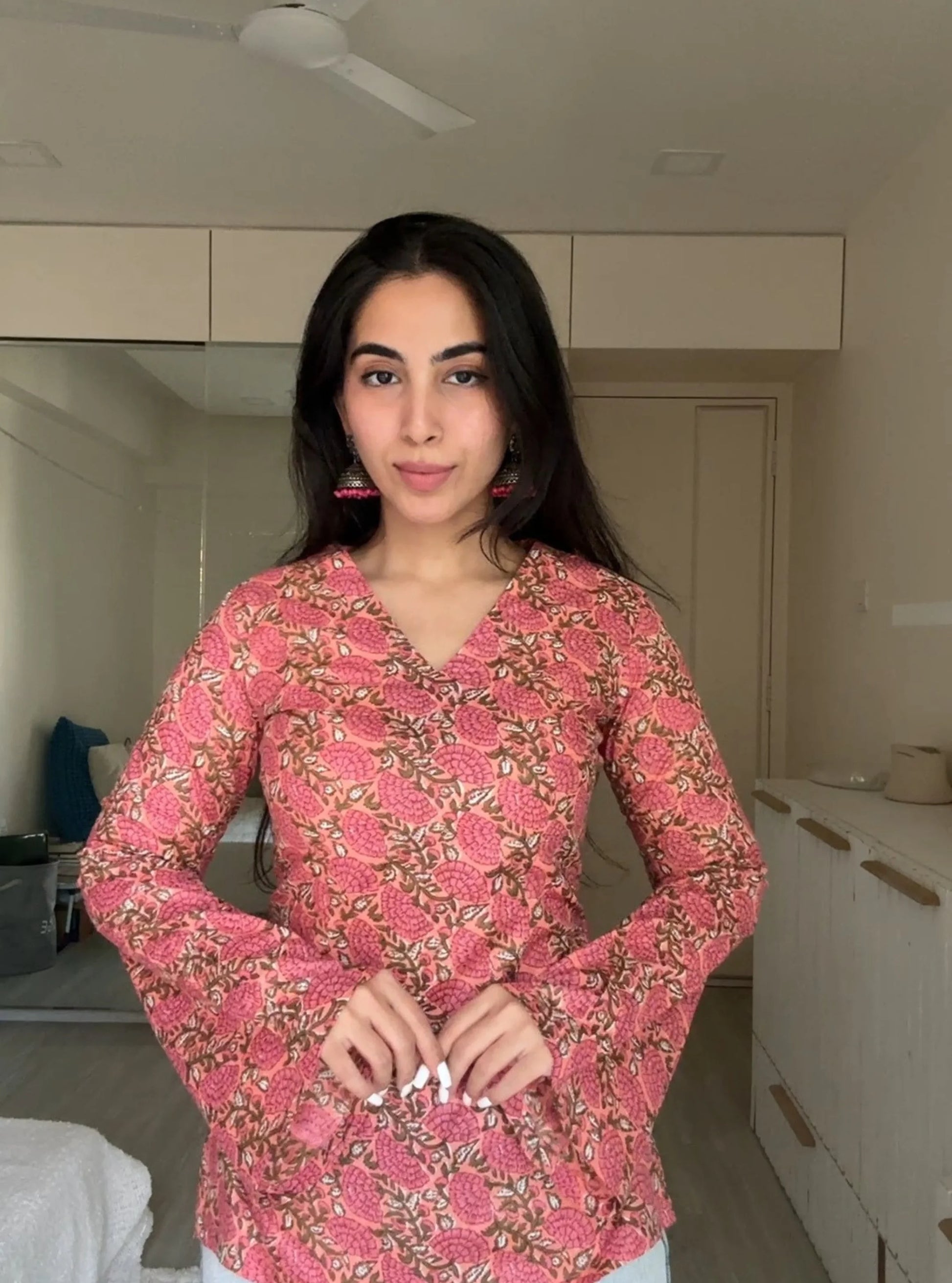 “Flared bell sleeves detail on Urvi pink floral kurti”