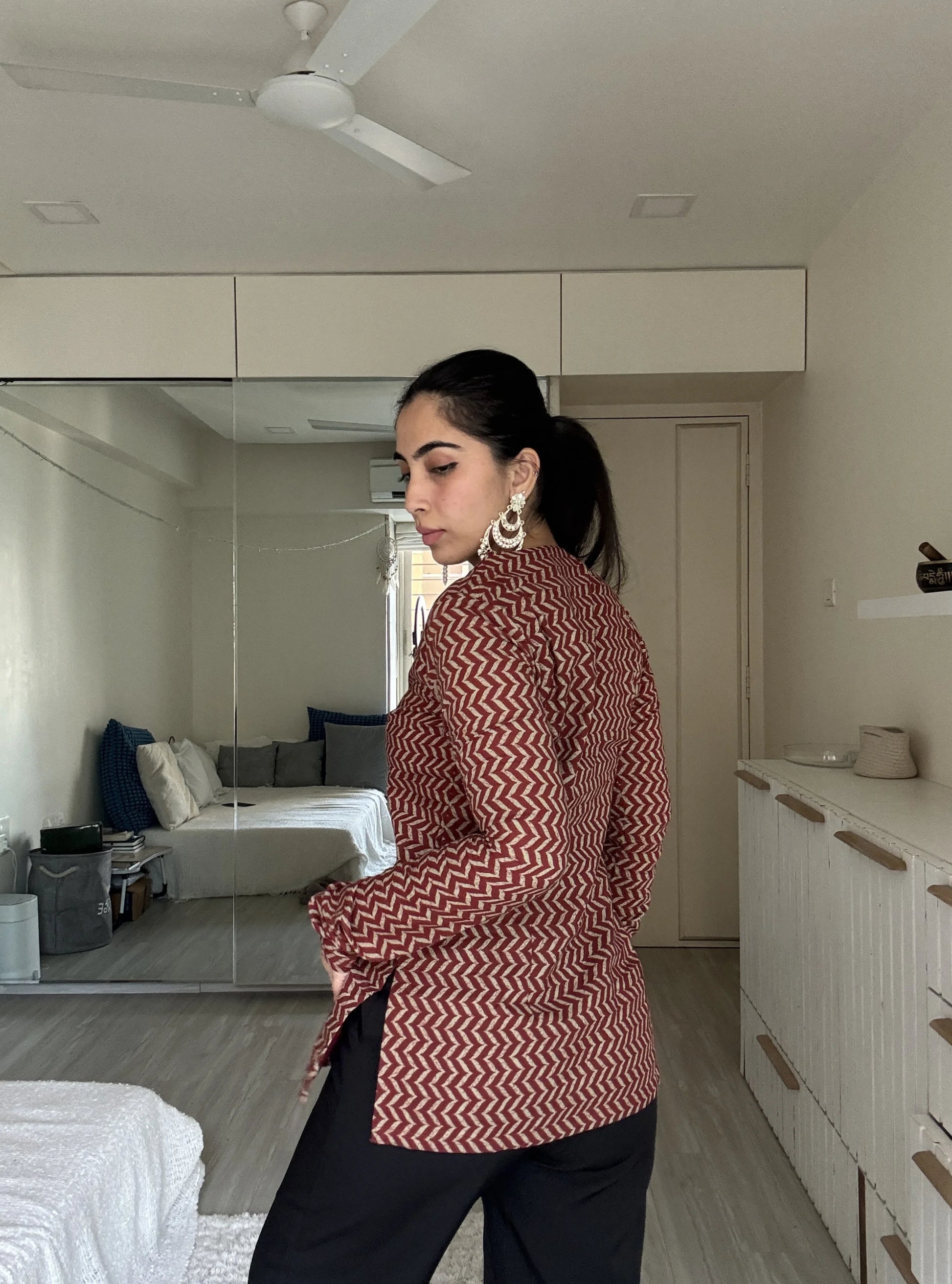 “Side view of Vaani maroon zigzag long sleeved kurti”